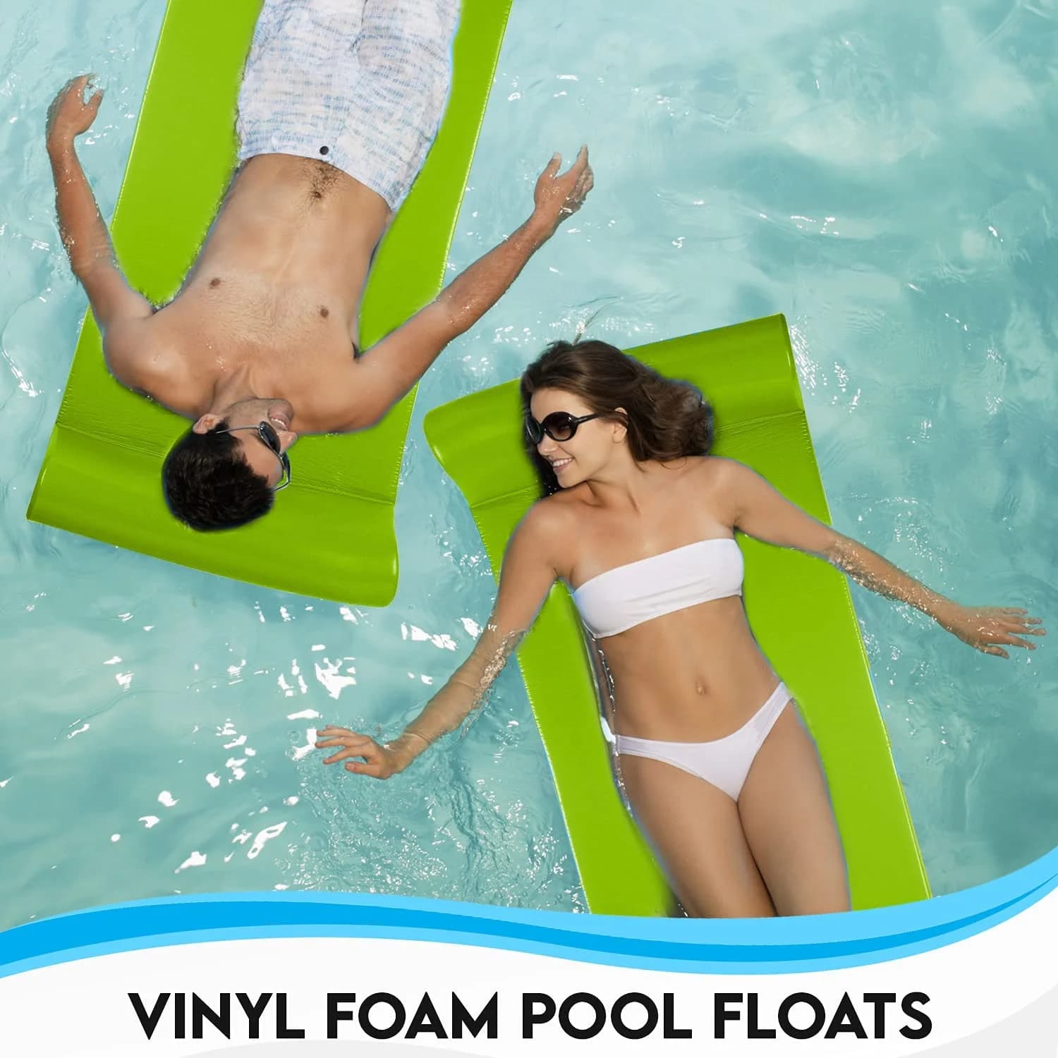 Couple lounging on Cococabana luxury foam pool floats in a backyard pool